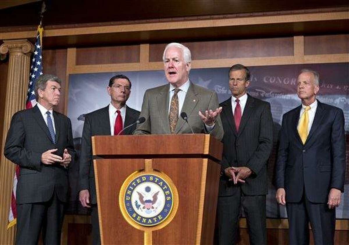 Senate Minority Whip John Cornyn, R-Texas, center, and other GOP senators, speak with reporters at the Capitol about the Affordable Care Act, popularly known as "Obamacare," at the Capitol in Washington, Wednesday, July 10, 2013. From left to right, Sen. Roy Blunt, R-Mo., Sen. John Barrasso, R-Wyo., Sen. John Cornyn, R-Texas, Sen. John Thune, R-S.D., and Sen. Jerry Moran, R-Kan. GOP lawmakers on the Hill have been calling for a delay in the law's requirement that individual Americans carry health insurance. President Barack Obama decided last week to grant a one-year delay for employers but leave in place provisions for individuals and families had created many new questions and concerns. (AP Photo/J. Scott Applewhite)