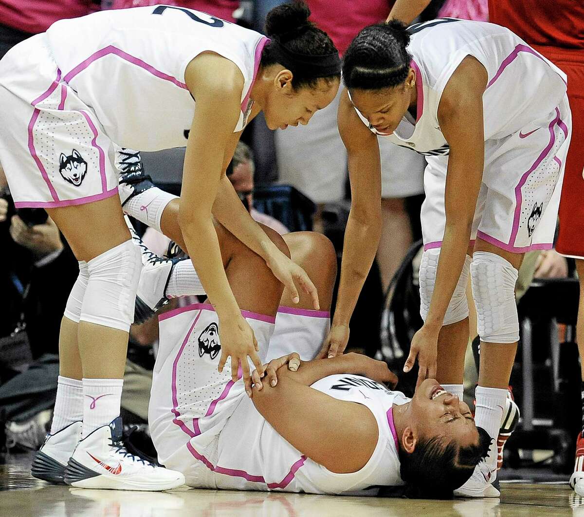 Losing Kaleena Mosqueda-Lewis, shown holding her arm after a hard fall to the court, to an illness is causing lineup changes for the UConn women’s basketball team.