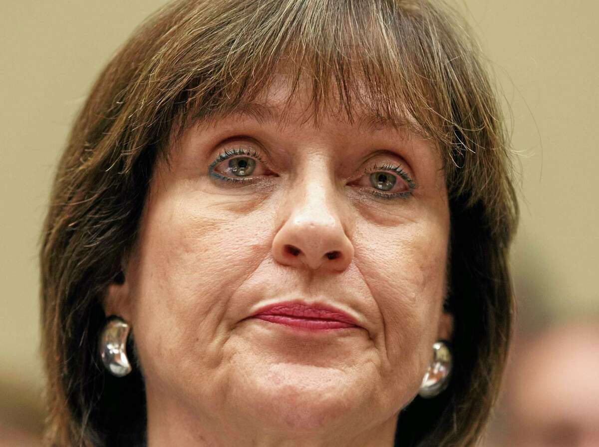 FILE - In this May 22, 2013 file photo, Internal Revenue Service official Lois Lerner refuses to answer questions as the House Oversight Committee holds a hearing to investigate the extra scrutiny the IRS gave Tea Party and other conservative groups that applied for tax-exempt status, on Capitol Hill in Washington. Lerner, a former IRS official at the heart of the agency's tea party controversial called Republicans "crazies" and more in newly released emails. Lerner used to head the IRS division that handles applications for tax-exempt status. In a series of emails with a colleague in November 2012, Lerner made two disparaging remarks about members of the GOP, including one remark that was profane. House Ways and Means Committee Chairman Rep. Dave Camp, R-Mich., released the emails Wednesday as part of his committee's investigation. Camp says the emails show Lerner's disgust with conservatives. (AP Photo/J. Scott Applewhite, File)