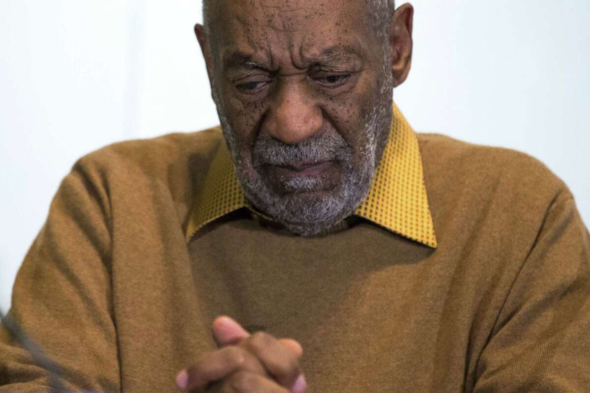 FILE - In this Nov. 6, 2014 file photo, entertainer Bill Cosby pauses during a news conference. Cosby’s attorney said Sunday, Nov. 16, 2014 that Cosby will not dignify “decade-old, discredited” claims of sexual abuse with a response, the first reaction from the comedian to an increasing uproar over allegations that he sexually assaulted several women in the past.