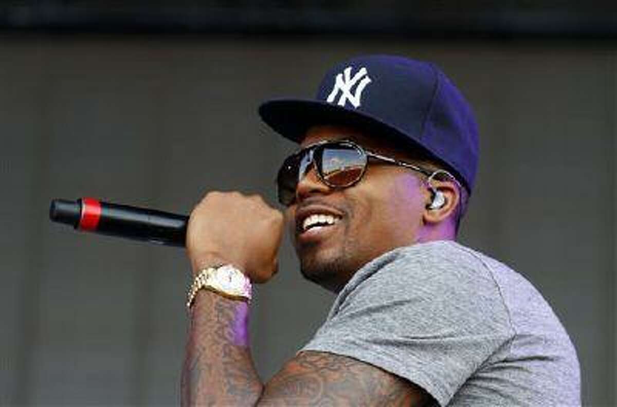 FILE - In this June 15, 2013 file photo, Nasir bin Olu Dara Jones, better known as Nas, performs at the 2013 Bonnaroo Music and Arts Festival in Manchester, Tenn. Harvard University announced Tuesday, July 16, that the 39-year-old rapper is being honored with the Nasir Jones Hip-Hop Fellowship at its W. E. B. Du Bois Institute. It is a joint venture with Harvard's Hip-Hop Archive. The fellowship will assist students who excel in the arts "in connection with hip-hop." Nas is one of hip-hop's most celebrated lyricists, best known for his reflective rhymes and deep storytelling. (Photo by Wade Payne/Invision/AP, File)