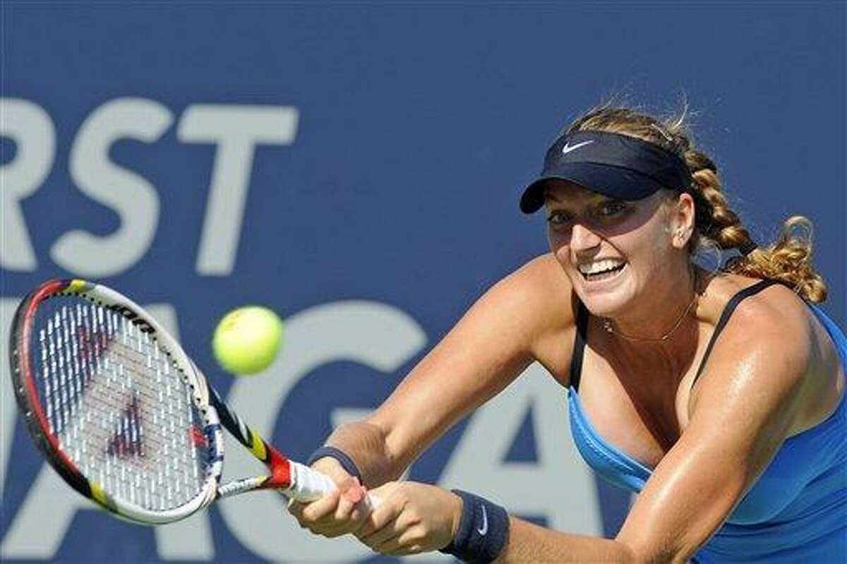 Petra Kvitova, of the Czech Republic, stretches for a backhand during her 7-6 (9), 7-5 victory over Maria Kirilenko, of Russia, in the final match of the New Haven Open tennis tournament in New Haven, Conn., on Saturday, Aug. 25, 2012. (AP Photo/Fred Beckham)