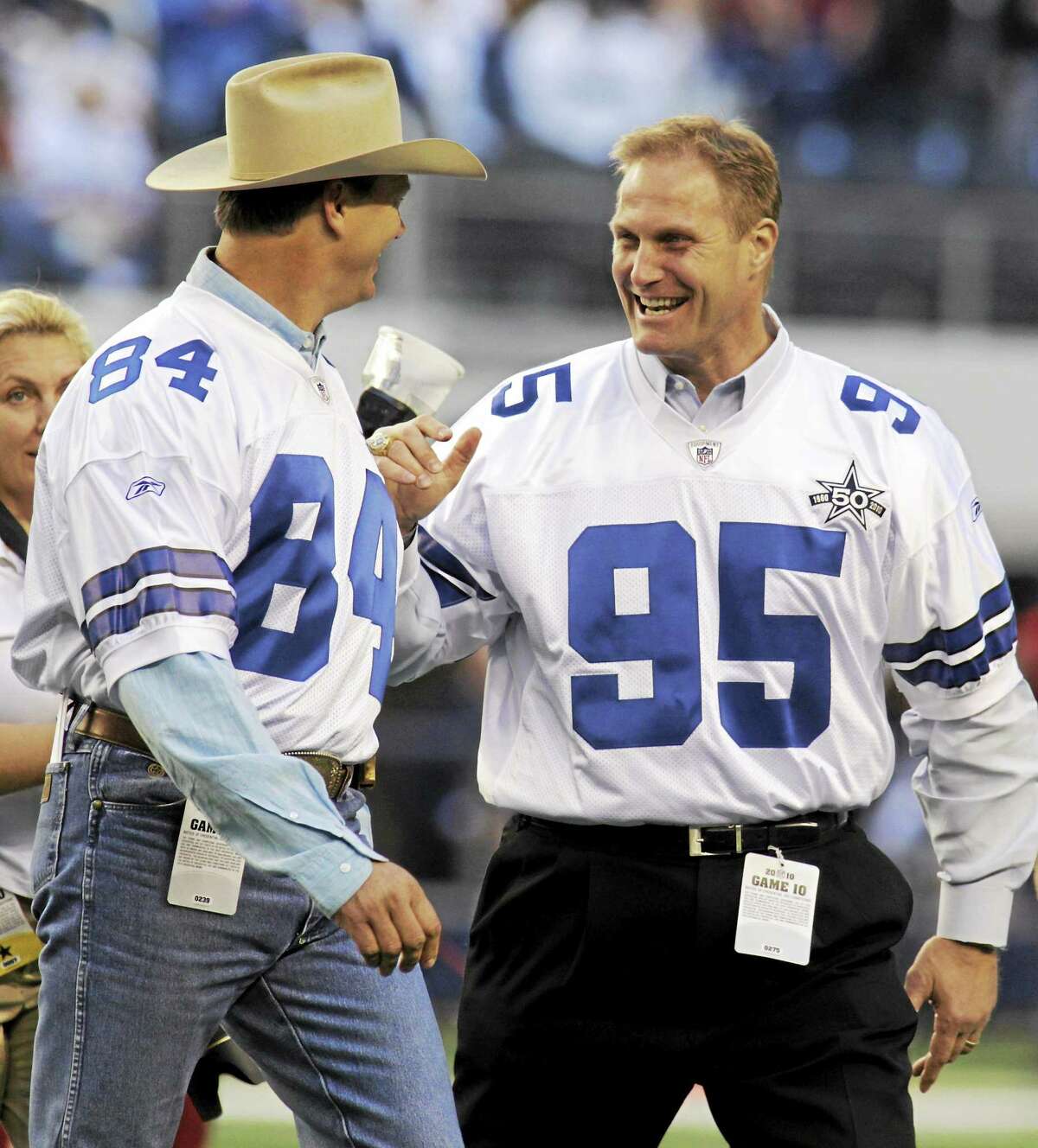 Former Dallas Cowboys defensive lineman Chad Hennings, right, is the recipient of the 2014 Walter Camp Football Foundation Alumni Award. At left is Jay Novacek.