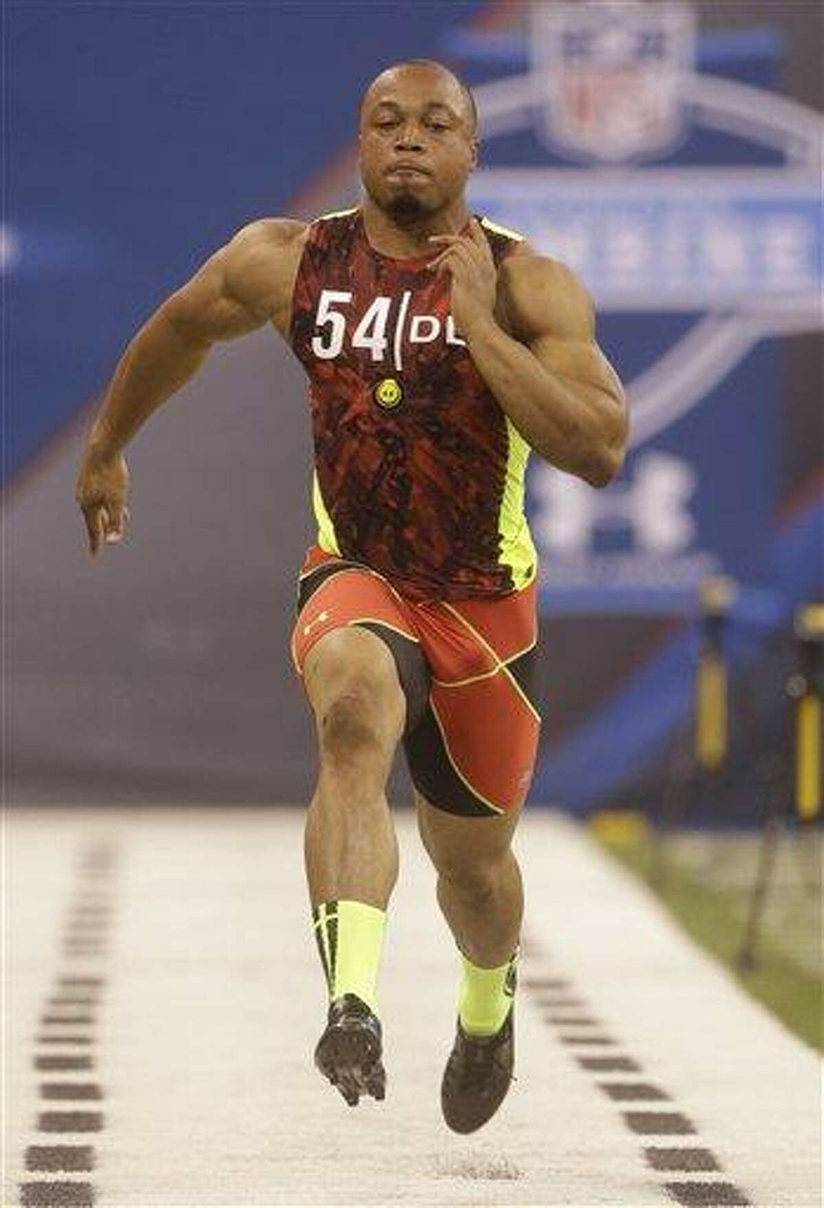 Connecticut defensive lineman Trevardo Williams runs a drill during the NFL football scouting combine in Indianapolis, Monday, Feb. 25, 2013. (AP Photo/Dave Martin)