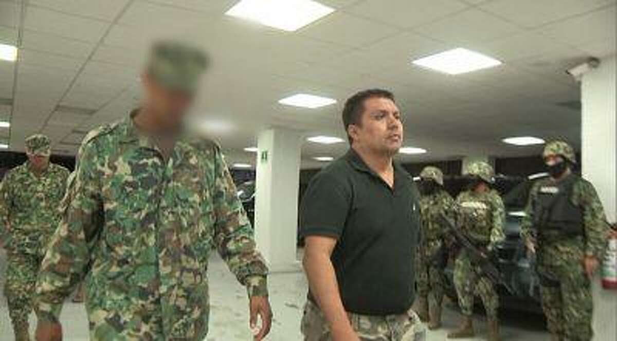 A frame grab taken from a video filmed by the SEMAR and released to Reuters on July 16, 2013 shows Miguel Angel Trevino.