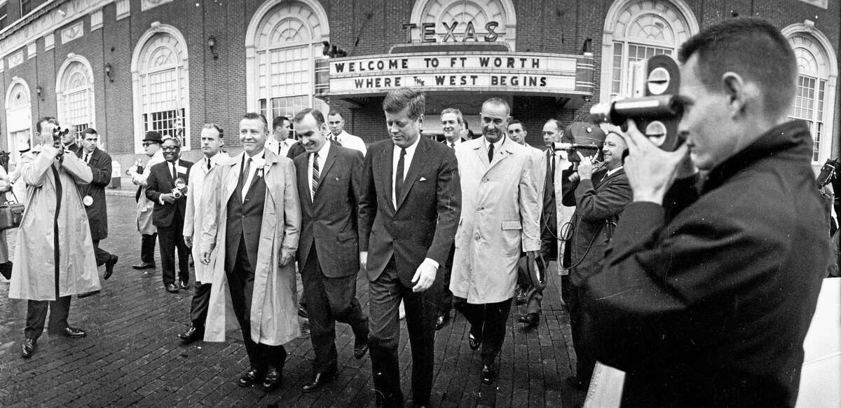 FILE - In this Friday morning, Nov. 22, 1963 file photo, President John F. Kennedy, center, and Vice President Lyndon Johnson, center right, walk with others in downtown Fort Worth, Texas. Later in the morning, they headed to Dallas for a motorcade to a planned luncheon speech. It was part of a trip to help mend a rift among Texas Democrats and try to secure the state for Kennedy in the 1964 election. (AP Photo/Houston Chronicle)
