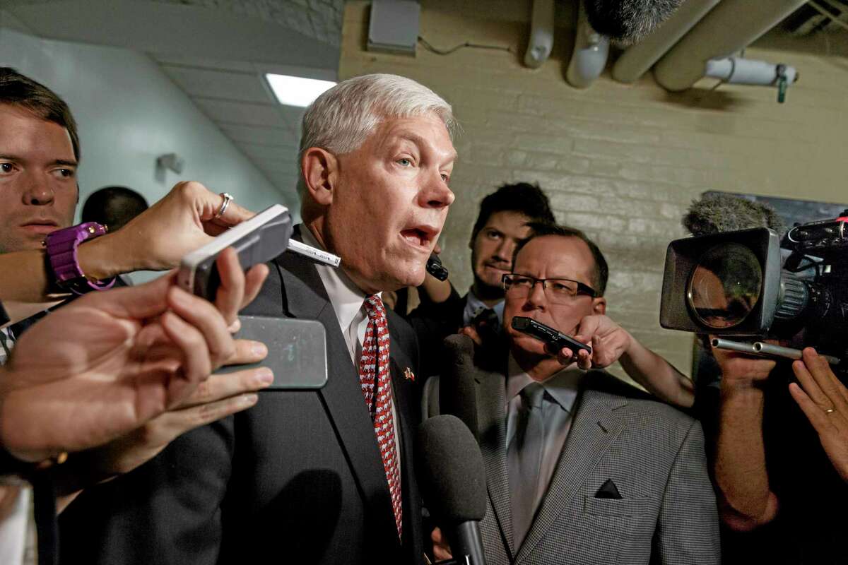 House Rules Committee Chairman, Rep. Pete Sessions, R-Texas, speaks to reporters on Capitol Hill in Washington, Friday, July 25, 2014, as he emerges from a closed-door session with fellow Republicans. President Barack Obama will urge Central American leaders to help slow the influx of unaccompanied children fleeing their countries for the United States, even as Congress remains deeply divided over proposals to stem the crisis at the border.(AP Photo)