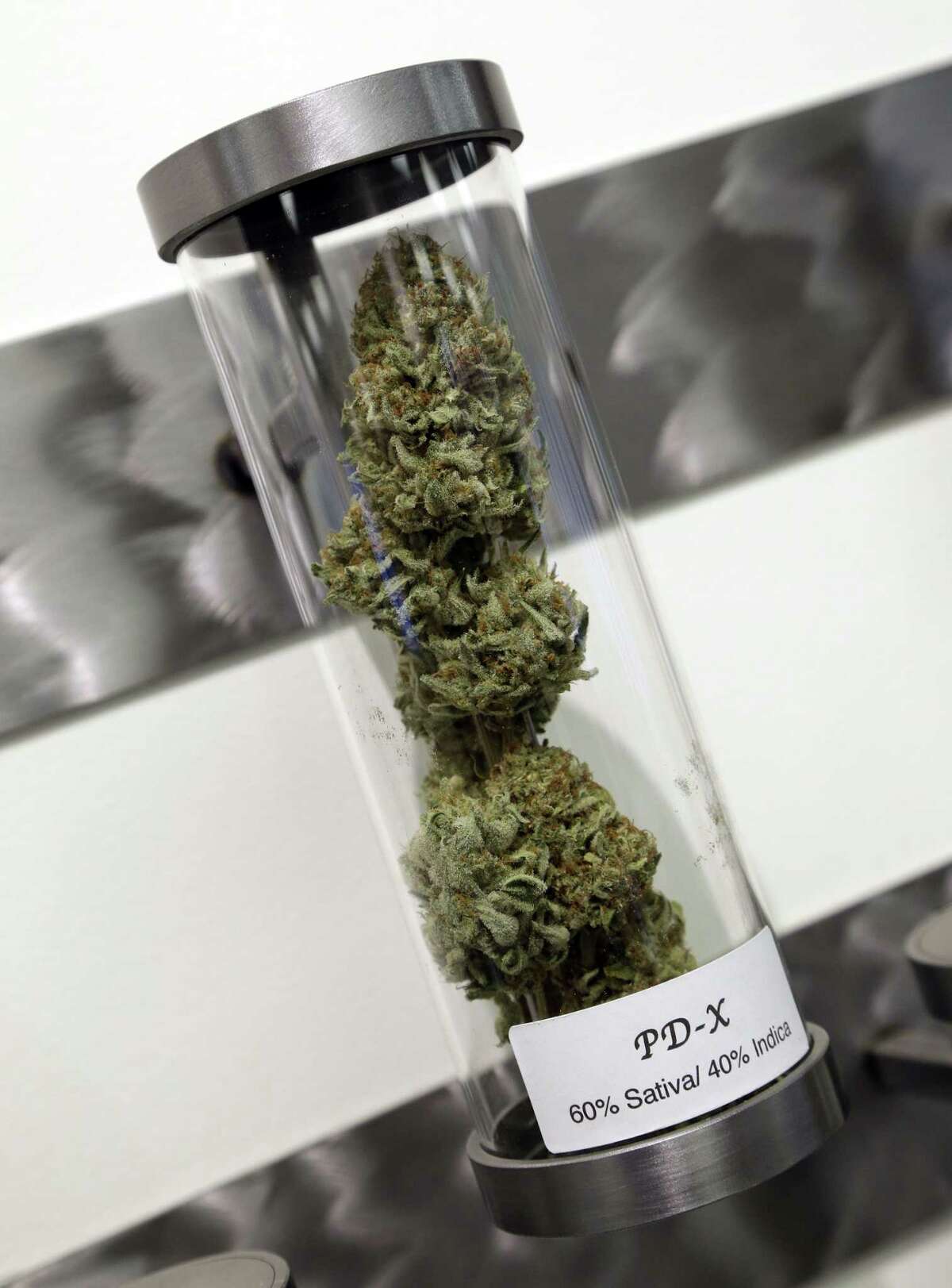 FILE - This Nov. 5, 2014, file photo shows a sample of medical marijuana displayed at Shango Premium Cannabis dispensary in Portland, Ore.