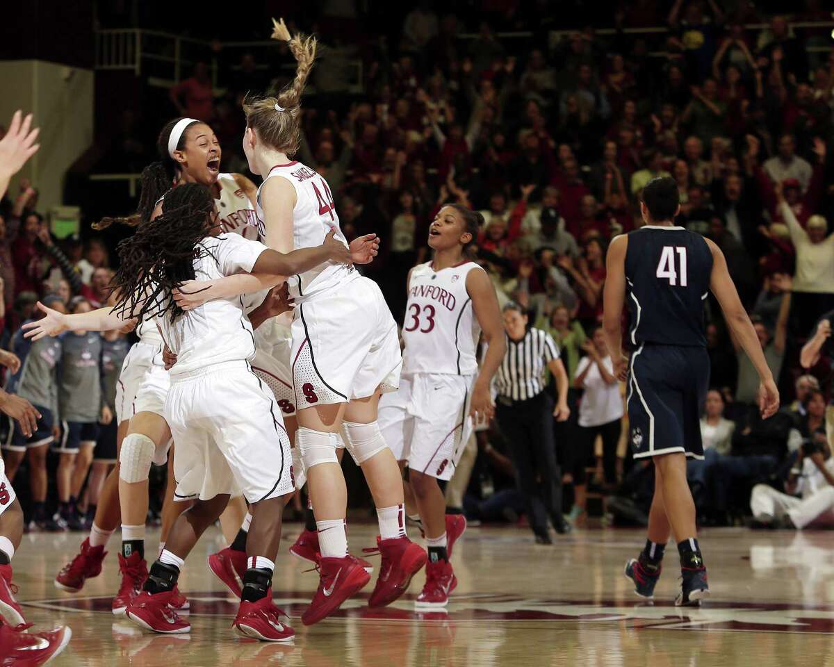 Stanford players celebrate after their 88-86 overtime win over UConn on Monday.