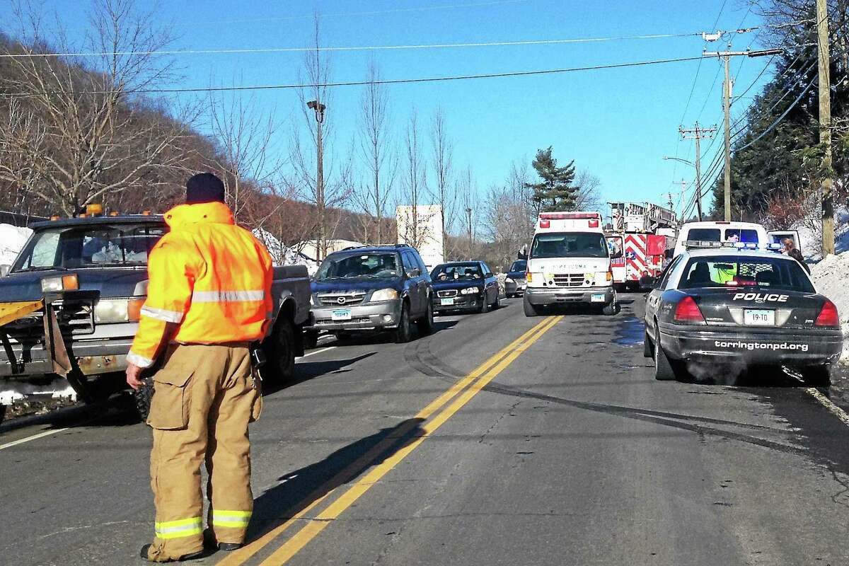 Emergency responders helped to direct traffic around an accident on Winsted Road Monday.