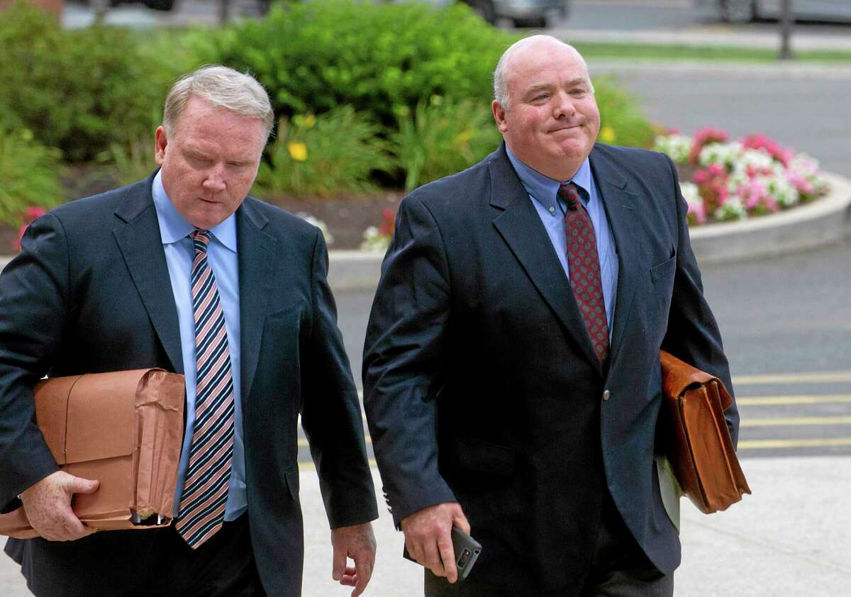 Michael Skakel, right, arrives at State Superior Court in Stamford, Conn., on Wednesday, July 30, 2014, with his attorney, Stephan Seeger, left. A Connecticut judge ordered prosecutors Wednesday to preserve all evidence as Skakel awaits a new trial in his murder case.