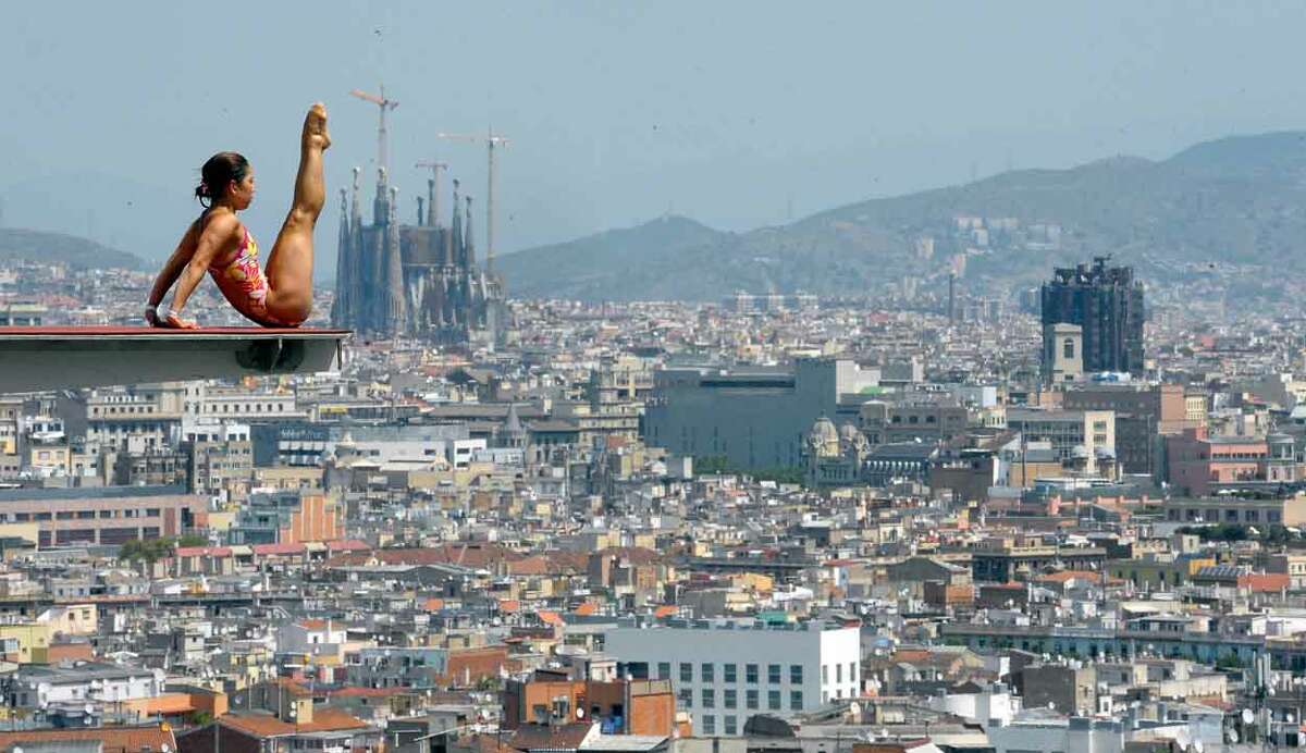 The Sagrada Familia cathedral is seen in the background as an unidentified diver practices ahead of the FINA World Championships in Barcelona, Spain, Monday, July 15, 2013. The FINA swimming World Championships run from July 19 to Aug. 4 in Barcelona. (AP Photo/Manu Fernandez)