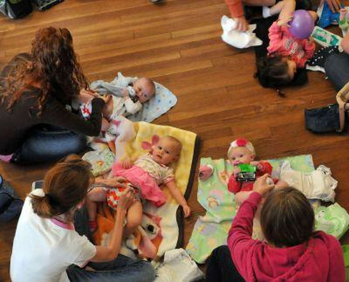 Parents change their children during the "Great Cloth Diaper Change" Saturday morning April 20, 2013 during the Earth Day Festival Green Baby Expo at the American Legion in Savannah Georgia. Around 65 parents participated in the Guinness World Record attempt in Savannah, which was one of several participating locations around the world. (AP Photo/The Morning News, Richard Burkhart) THE EXAMINER.COM OUT; SFEXAMINER.COM OUT; WASHINGTONEXAMINER.COM OUT