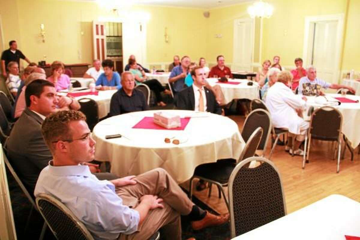 Esteban L. Hernandez-Register Citizen - A crowd listens as the Torrington Republican Town Committee unveils its 2013 slate of candidates for city-wide offices in Torrington Tuesday at the Yankee Peddler Inn.