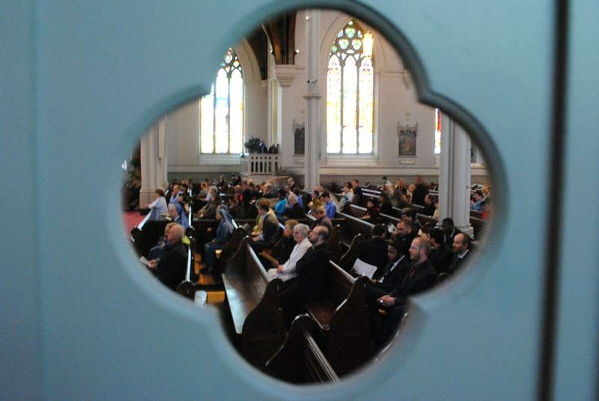 A view of worshipers inside Cathedral of the Holy Cross. Photo By Ashley May