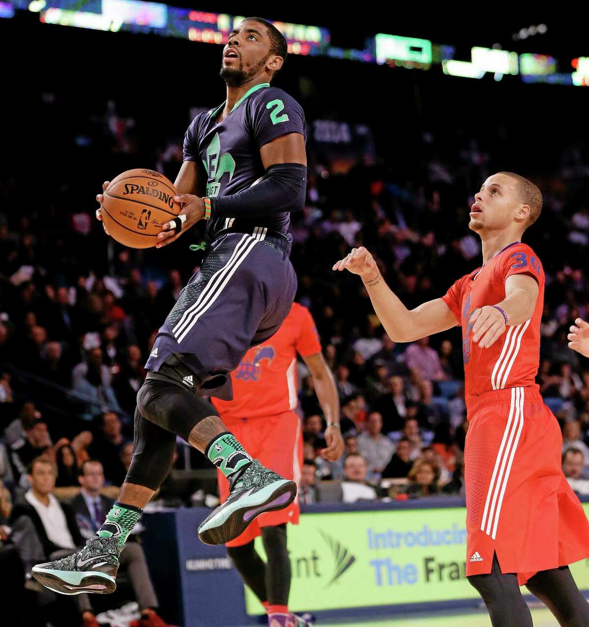 The East team’s Kyrie Irving goes to the hoop during the NBA All Star game Sunday in New Orleans.