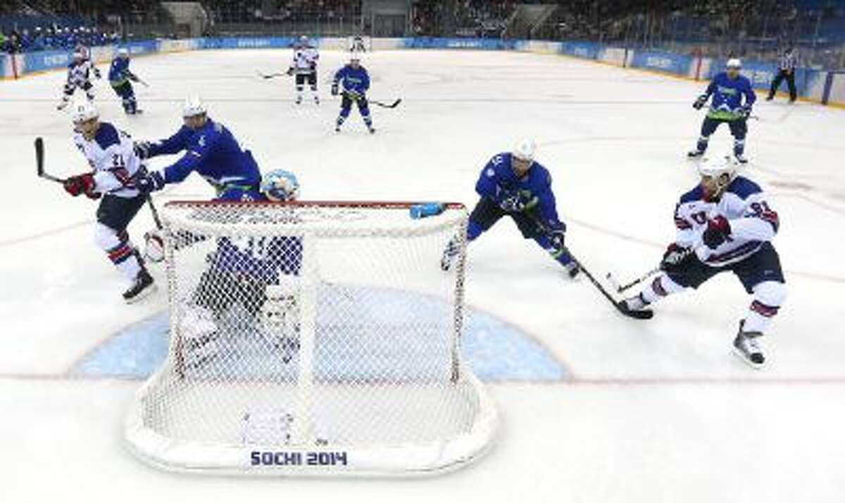 Phil Kessel of the United States puts in his third goal against Slovenia during the Men's Ice Hockey Preliminary Round Group A game on day nine of the Sochi 2014 Winter Olympics at Shayba Arena on Feb. 16.
