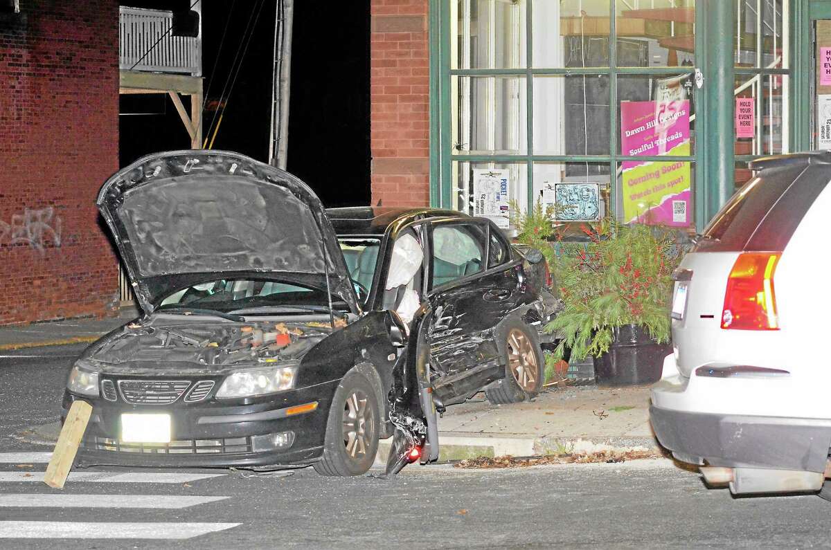 A two-vehicle accident on Water St. in Torrington Monday night resulted in only minor injuries, though rescue workers had to help extract one driver due to damage from the impact. The black sedan struck Morrison's Hardware, but no one in or near the building was injured.John Berry - Register Citizen