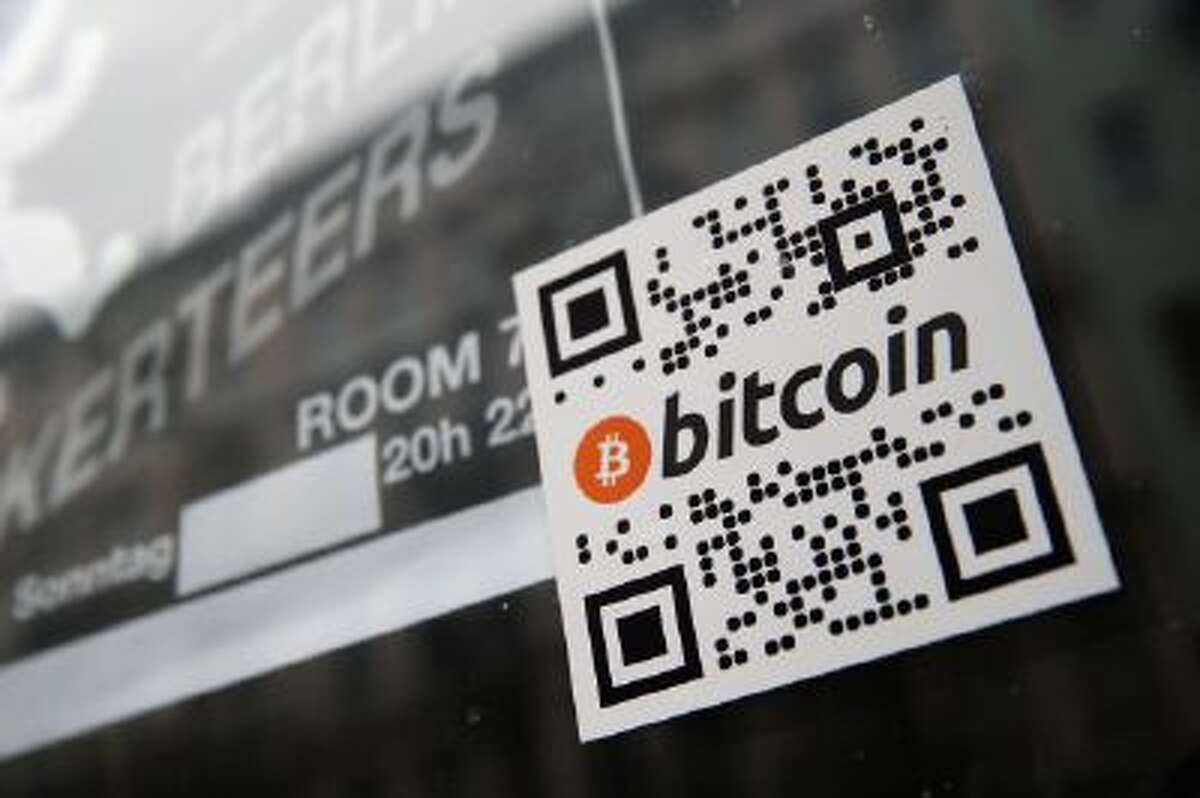 A sticker on the window of a local pub indicates the acceptance of Bitcoins for payment on April 11, 2013 in Berlin, Germany.