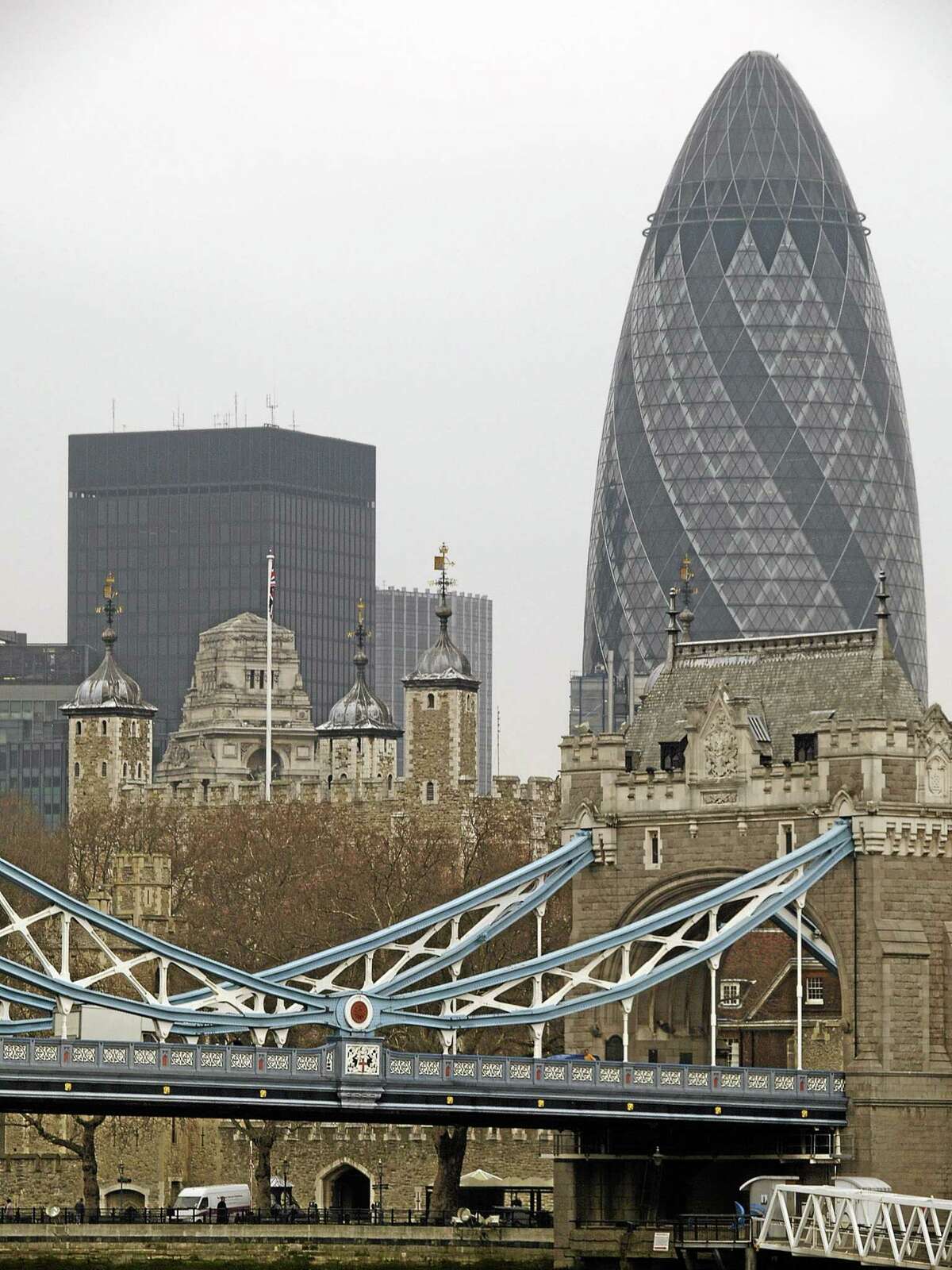 FILE - This Monday Feb. 5, 2007 file photo shows the Gherkin over London's Tower Bridge, and the Tower of London. One of Londonís most iconic office buildings has been put up for sale. The Norman Foster-designed tower, nicknamed The Gherkin for its distinctive pickle-like shape, was put into bankruptcy protection last year. Deloitte Real Estate and Savills expect interest in the building to come from all over the globe. (AP Photo/Max Nash, File)