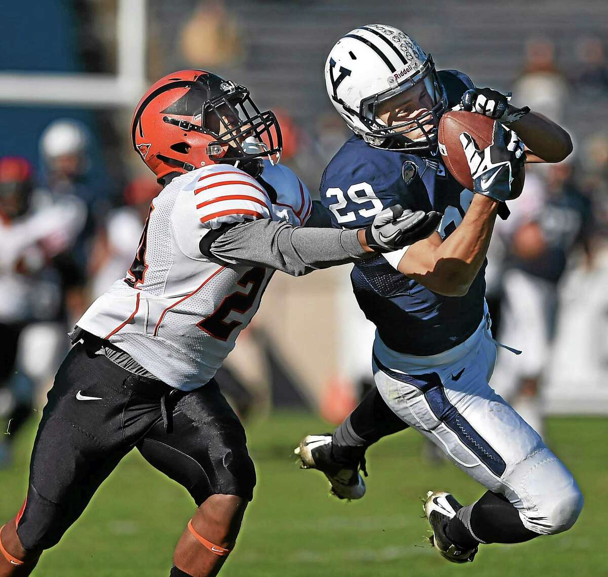 Yale’s Grant Wallace hauls in a pass while Princeton’s John Hill defends during the Bulldogs’ 44-30 win on Saturday afternoon at Yale Bowl in New Haven.