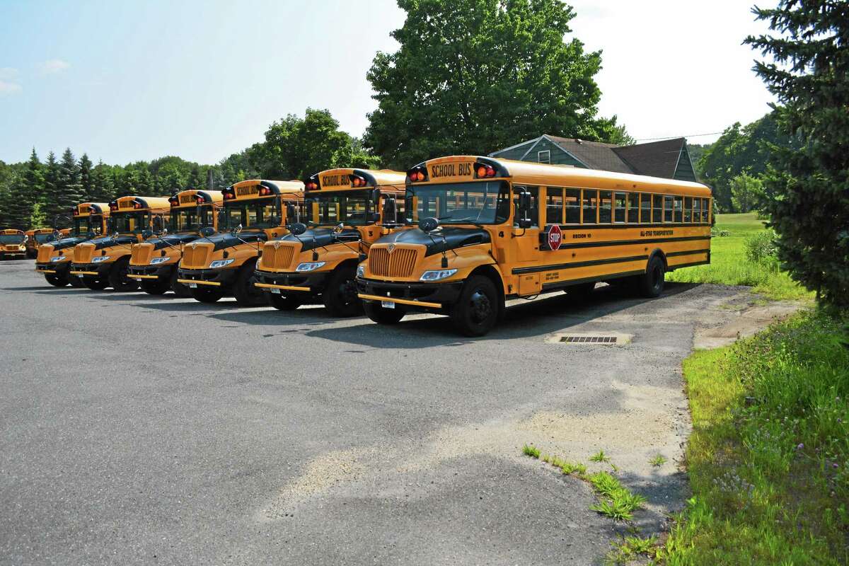 The current bus lot for the Burlington and Harwinton school buses, at Hank’s Garage.