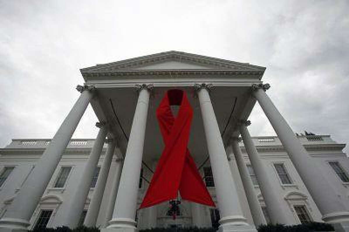 An AIDS ribbon hangs from the North Portico of the White House in Washington, November 30, 2010.