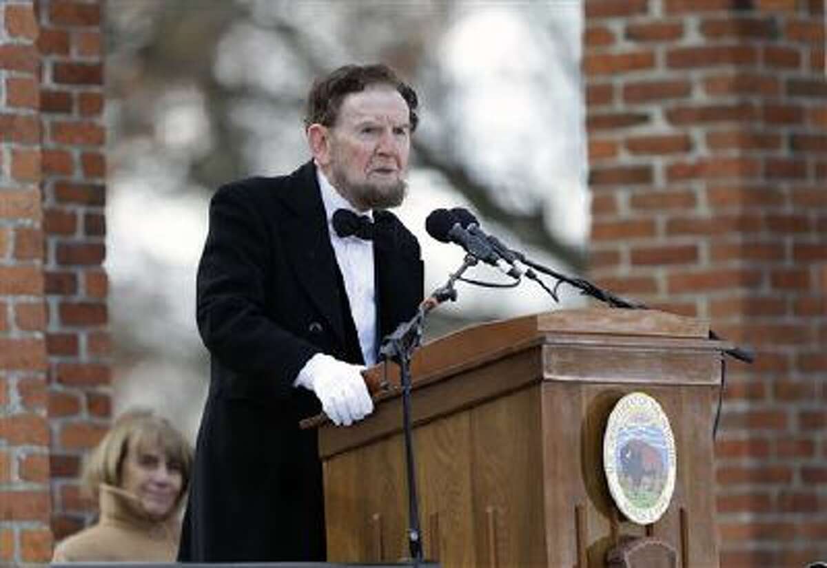 James Getty, portraying President Abraham Lincoln, recites the Gettysburg Address during a ceremony Tuesday commemorating the 150th anniversary of the dedication of the Soldiers' National Cemetery and the historic speech in Gettysburg, Pa. Lincoln's speech was first delivered in Gettysburg nearly five months after the major battle in 1863 that left tens of thousands of men wounded, dead or missing.