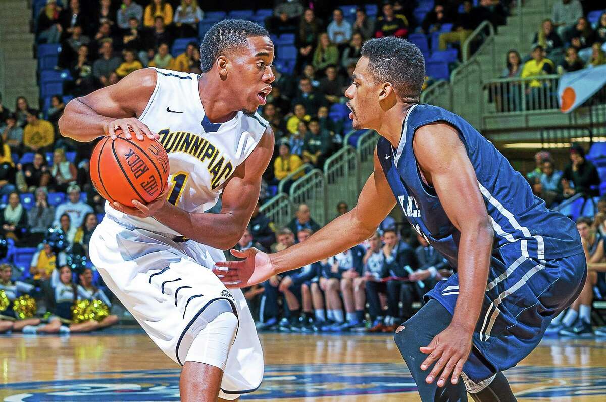 Quinnipiac senior guard Zaid Hearst, left, scored a game-high 35 points in the Bobcats’ 89-85 double-overtime win over Armani Cotton and Yale on Friday night at the TD Bank Sports Center in Hamden.