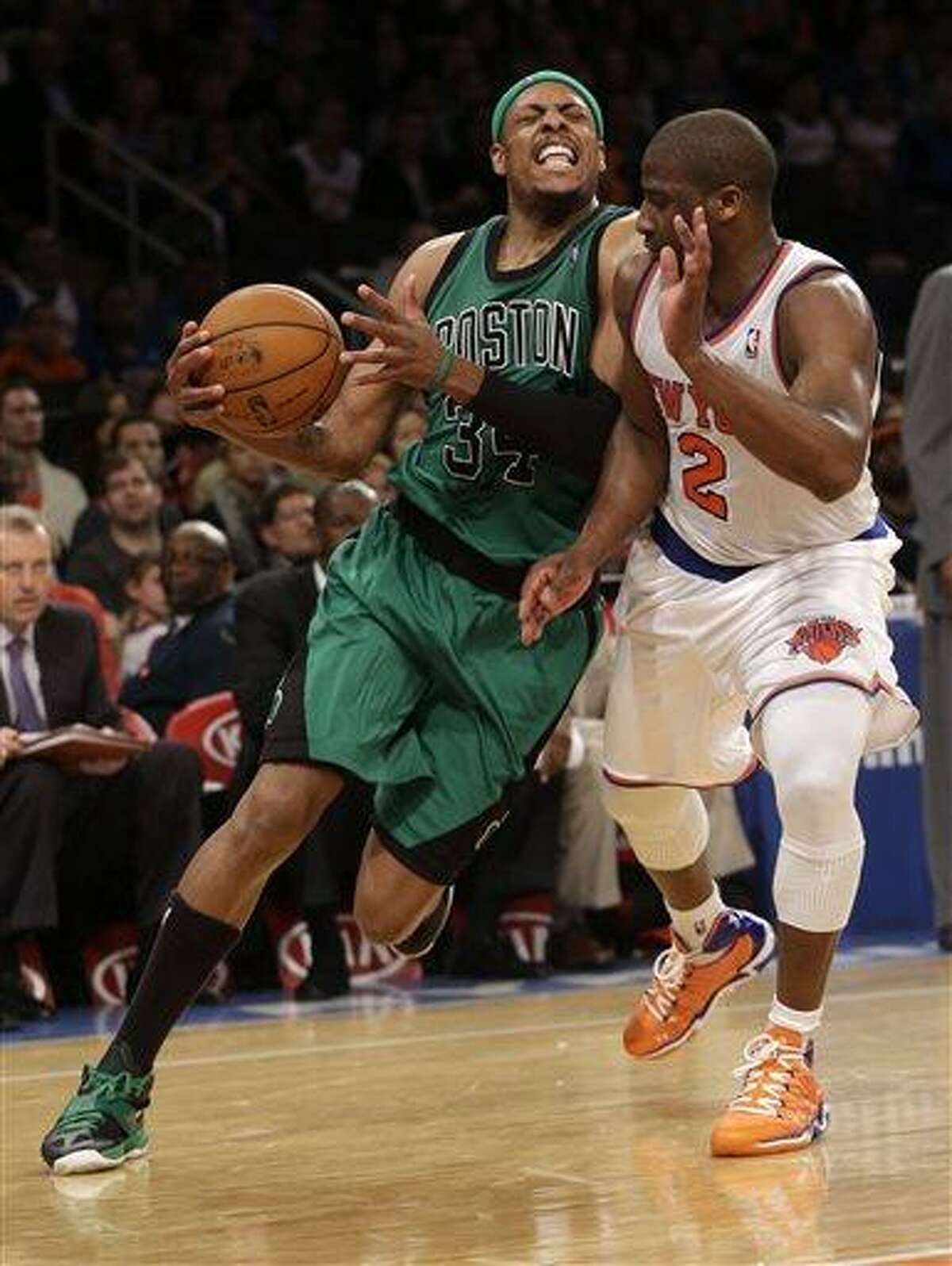 Boston Celtics' Paul Pierce, left, is fouled by New York Knicks' Raymond Felton during the second half of the NBA basketball game at Madison Square Garden Sunday, March 31, 2013 in New York. The Knicks beat the Celtics 108-89. (AP Photo/Seth Wenig)