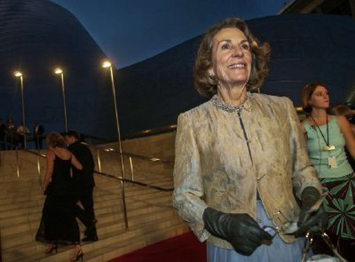 In this Oct. 23, 2003 file photo, Diane Disney Miller poses for photographers as she arrives for a grand opening concert gala at the new Walt Disney Concert Hall in Los Angeles.