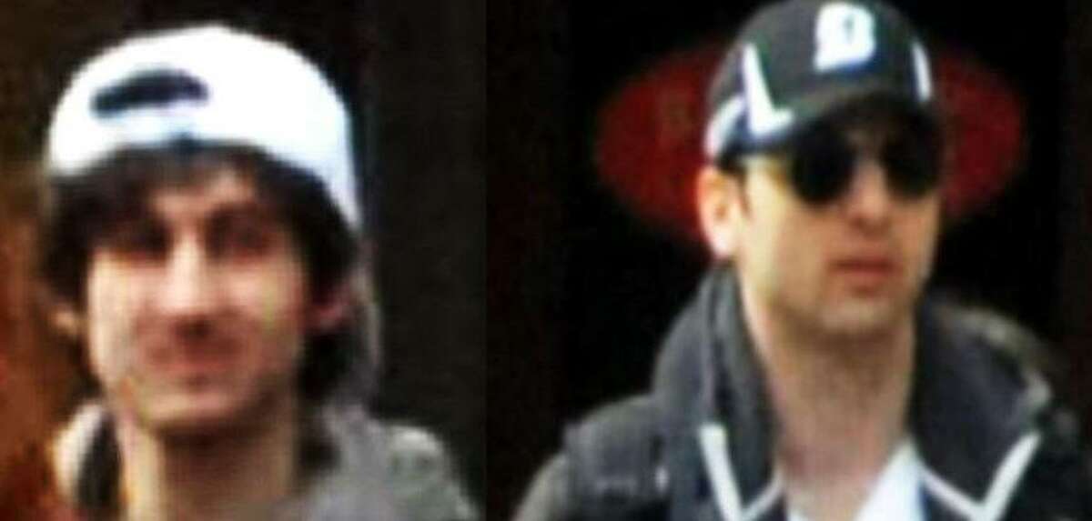 The left photo shows in a image from video what the FBI is calling suspect number 2 with a white hat, highlighted, walking in Boston on Monday, April 15, 2013, before the explosions at the Boston Marathon. The right photo shows in a image from video what the FBI is calling suspect number 1 with a black hat walking with a backpack. Photos released by the FBI.