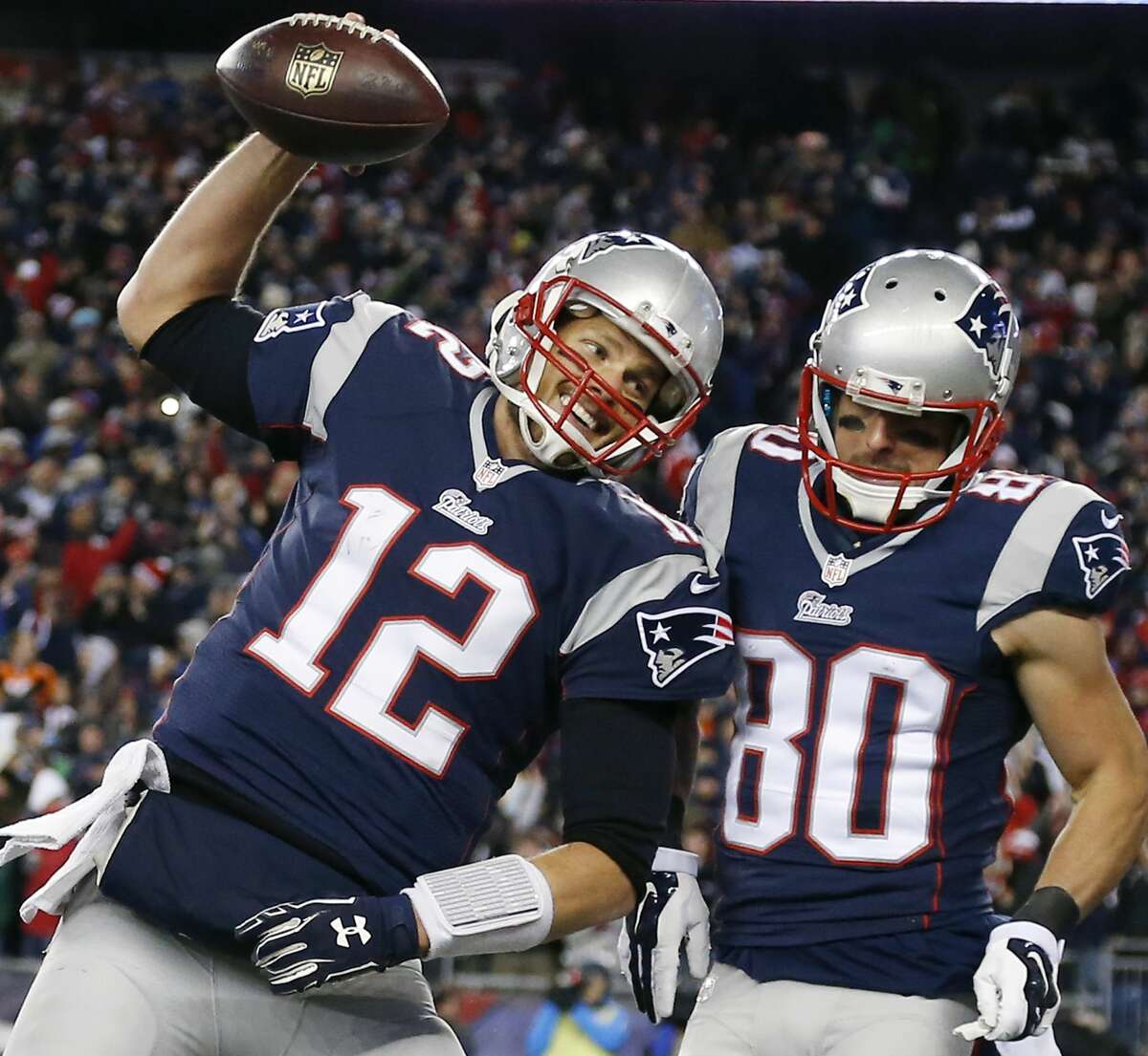 New England Patriots quarterback Tom Brady (12) celebrates with receiver Danny Amendola (80) in the first half of their Nov. 2 win over the Denver Broncos in Foxborough, Mass.