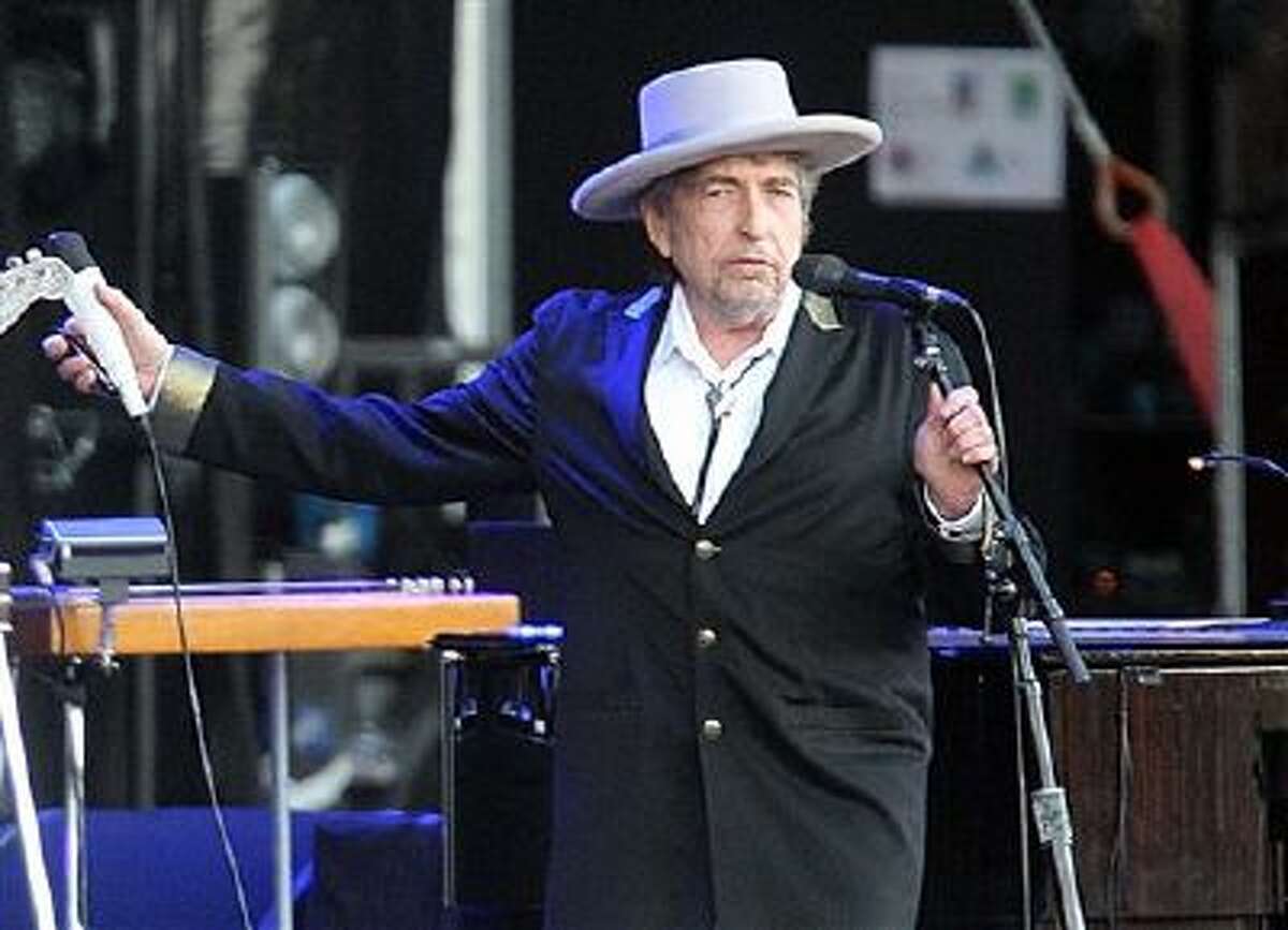 This July 22, 2012 file photo shows U.S. singer-songwriter Bob Dylan performing on at "Les Vieilles Charrues" Festival in Carhaix, western France.