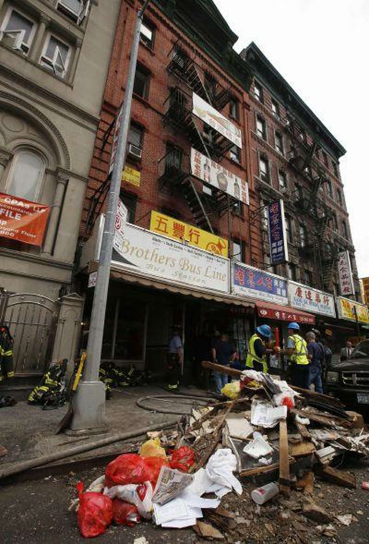 Debris is seen outside a five-story building that partially collapsed after a reported explosion in New York July 11, 2013.