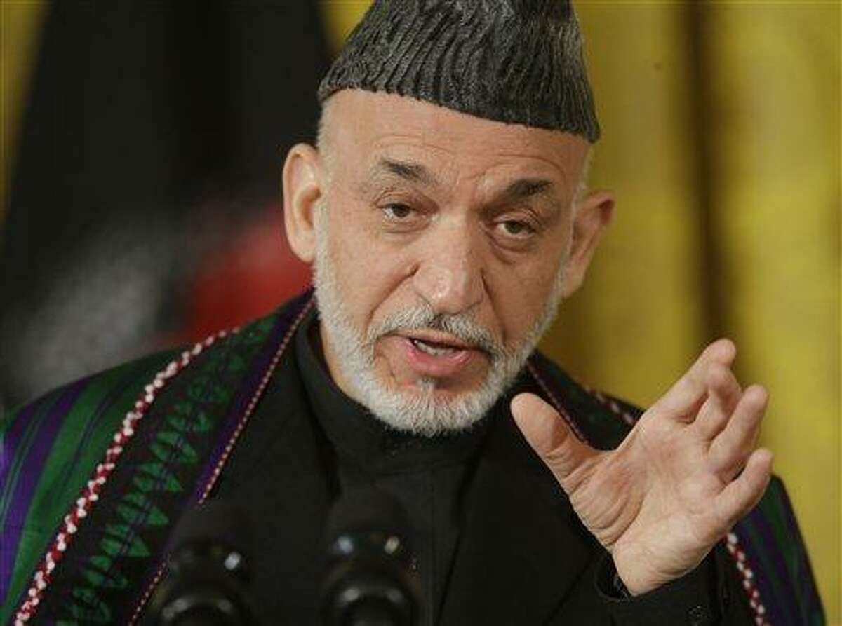 Afghan President Hamid Karzai gestures as he answers questions during a joint news conference with President Barack Obama in the East Room of the White House in Washington, Friday, Jan. 11, 2013. (AP Photo/Pablo Martinez Monsivais)