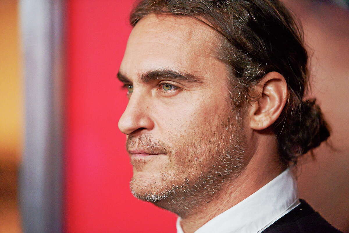Joaquin Phoenix arrives at the LA Premiere of “Her” on December 12, 2013 in Los Angeles.