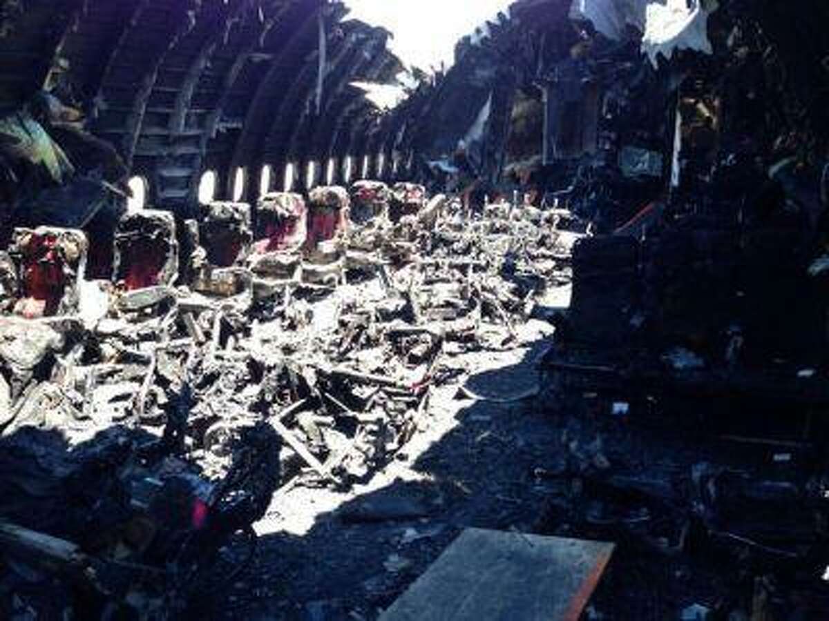 The charred interior cabin of Asiana Airlines Flight 214 is pictured after its crash landing on Saturday in San Francisco, California, in this undated National Transportation Safety Board (NTSB) handout photo.