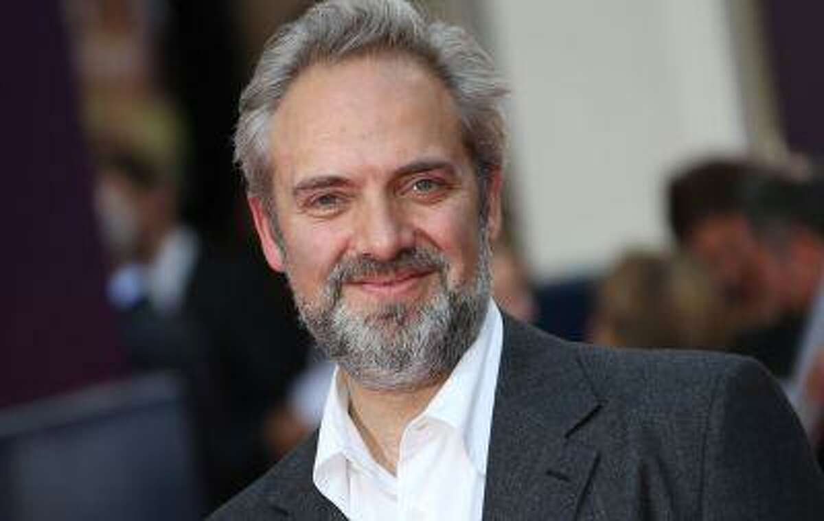 Director Sam Mendes arrives for the opening night of Charlie and the Chocolate Factory, a new stage musical based on Roald Dahl's popular story about Willy Wonka and his amazing Chocolate Factory, at the Drury Lane Theatre in central London, Tuesday, June 25, 2013. (Photo by Joel Ryan/Invision/AP)