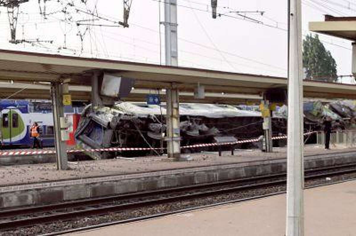 A picture shows a derailed wagon on the site of a train accident in the railway station of Bretigny-sur-Orge on July 12 near Paris. A train derailed in the Paris suburb of Bretigny-sur-Orge in an accident that caused 'many casualties', authorities said.