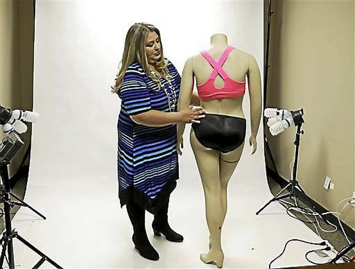 Jessica Asmar, owner of Feel Foxy, repositions a mannequin wearing a pair of padded panties Oct. 29 in the studio at her Katy, Texas warehouse. Asmar says 2014 has been its best year since launching nearly a decade ago. Sales are up 40 percent from a year ago.