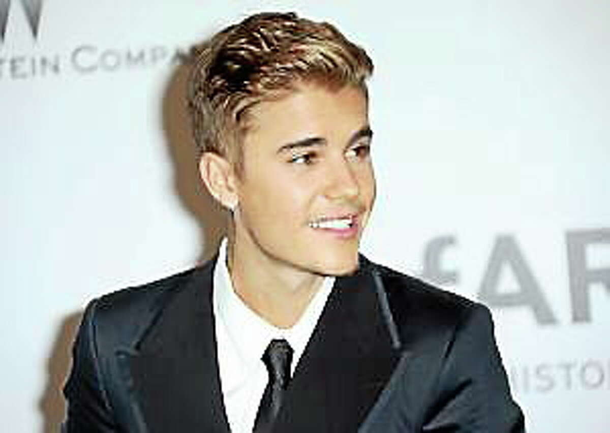 Justin Bieber arrives at the amfAR Cinema Against AIDS benefit at the Hotel du Cap-Eden-Roc, during the 67th international film festival, in Cap d’Antibes, southern France, Thursday, May 22, 2014.