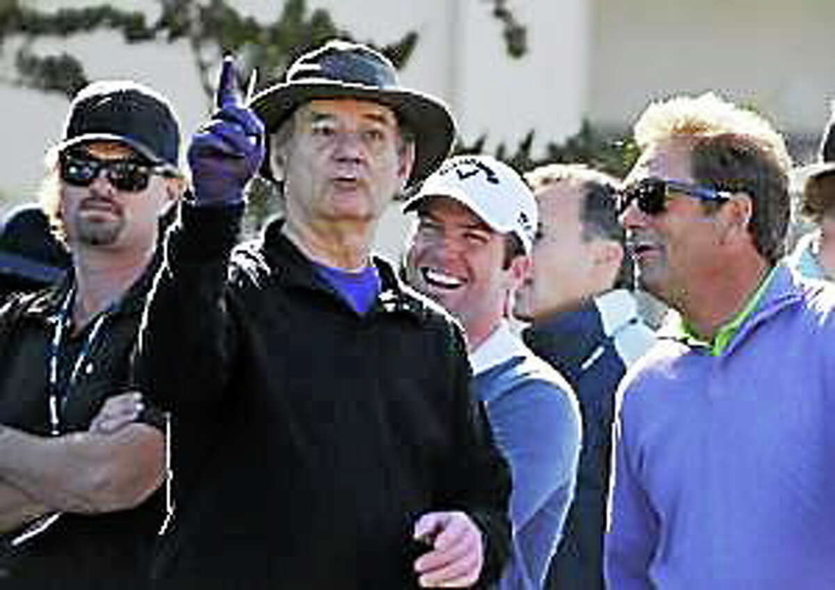 Bill Murray holds court on the 1st tee as actor Lucas Black, center, and singer Huey Lewis look on during the 3M Celebrity Challenge at Pebble Beach Golf Links in Pebble Beach Wednesday Feb. 8, 2012.