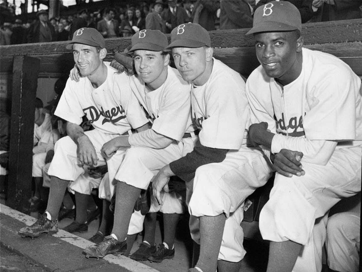 Third baseman John Jorgensen, left, purchased by the Brooklyn Dodgers from the Montreal Royals of the International League, joined the Dodgers on April 15, 1947 in time to start at third base in the season opener against Boston. The Dodgers starting infield, left to right, comprises Jorgensen, shortstop Pee Wee Reese, second baseman Ed Stanky, and first baseman Jackie Robinson, all of whom played in the opener at Ebbets Field, Brooklyn. (AP Photo)