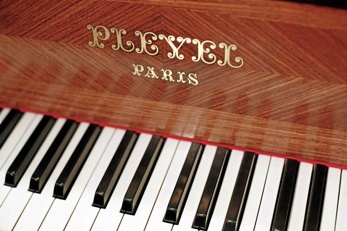 A Pleyel piano is exhibited in a display of instruments in Paris on Saturday. The French factory announced it will close because of costs and decreased demand after 206 years in business. (AP Photo/Thibault Camus)