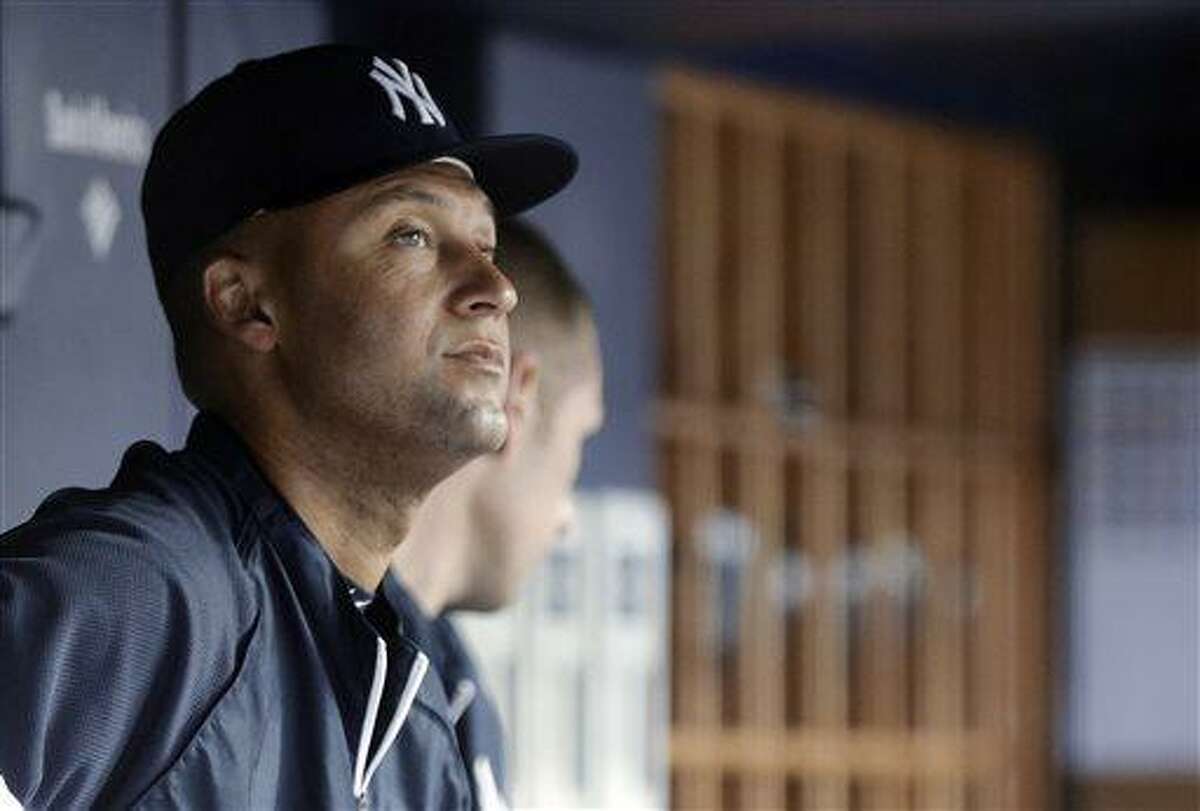 New York Yankees' Derek Jeter watches from the dugout during the second inning of the Yankees' baseball game against the Minnesota Twins on Friday, July 12, 2013, in New York. (AP Photo/Frank Franklin II)