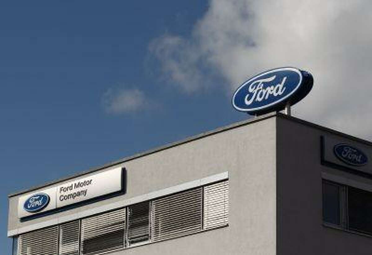 The Ford logo is pictured on the rooftop of Austria's Ford head branch in Vienna March 19, 2013. (REUTERS/Heinz-Peter Bader)