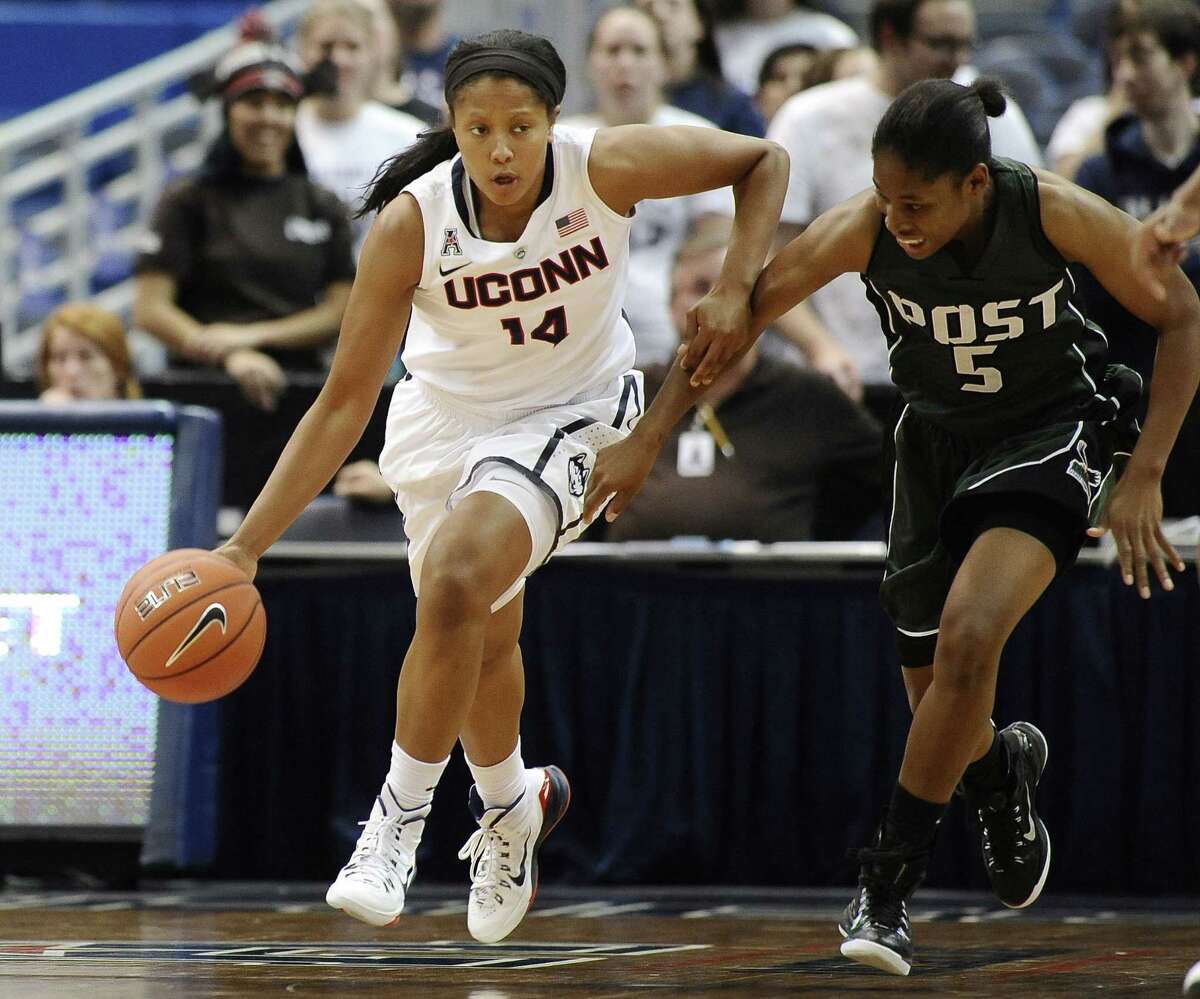 Connecticutís Sadie Edwards, left, is guarded by C.W. Postís Essence Casey, right, during the second half of an NCAA women's college basketball game, Sunday, Nov. 9, 2014, in Hartford, Conn. Connecticut won (AP Photo/Jessica Hill)