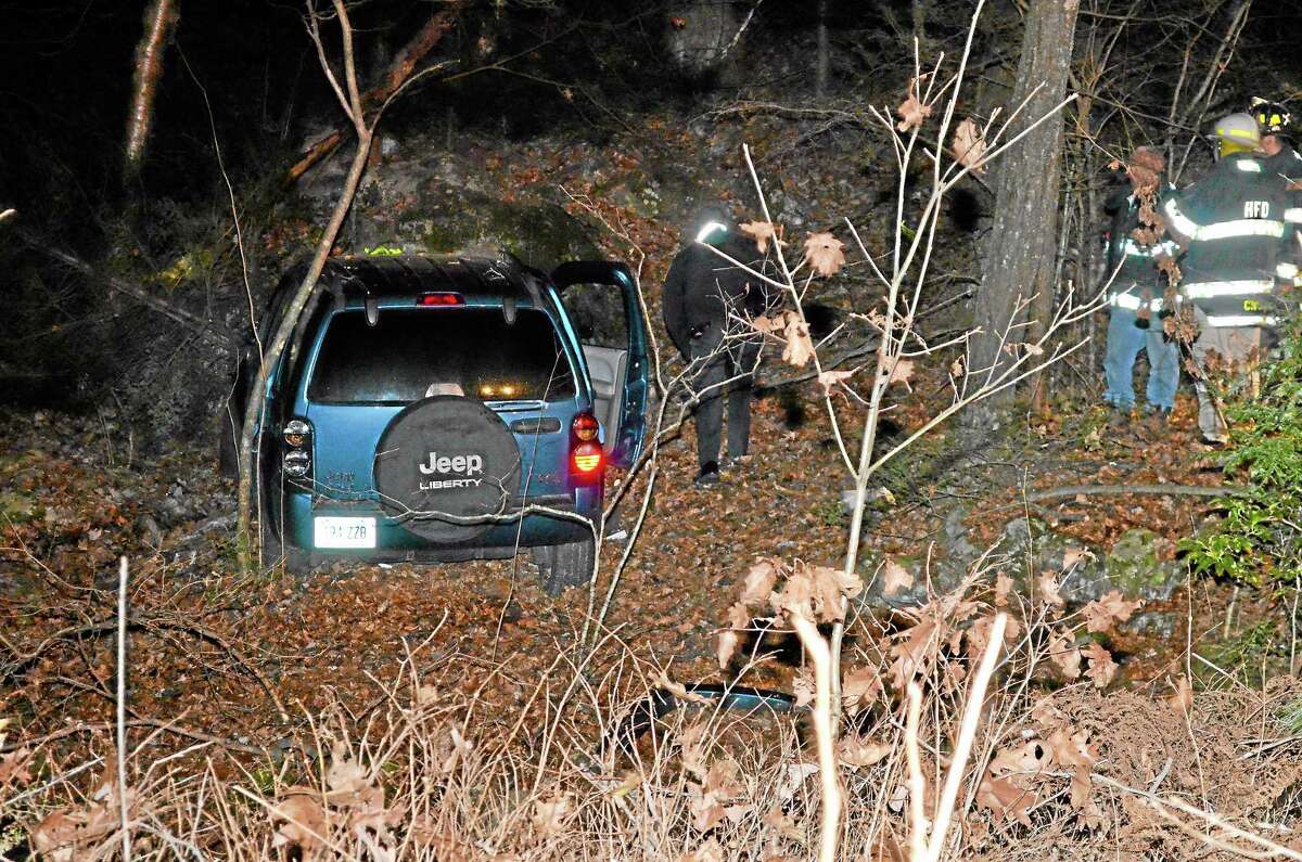 A blue Jeep Liberty traveled into the woods after veering off of Plymouth Road in Harwinton on Thursday night.