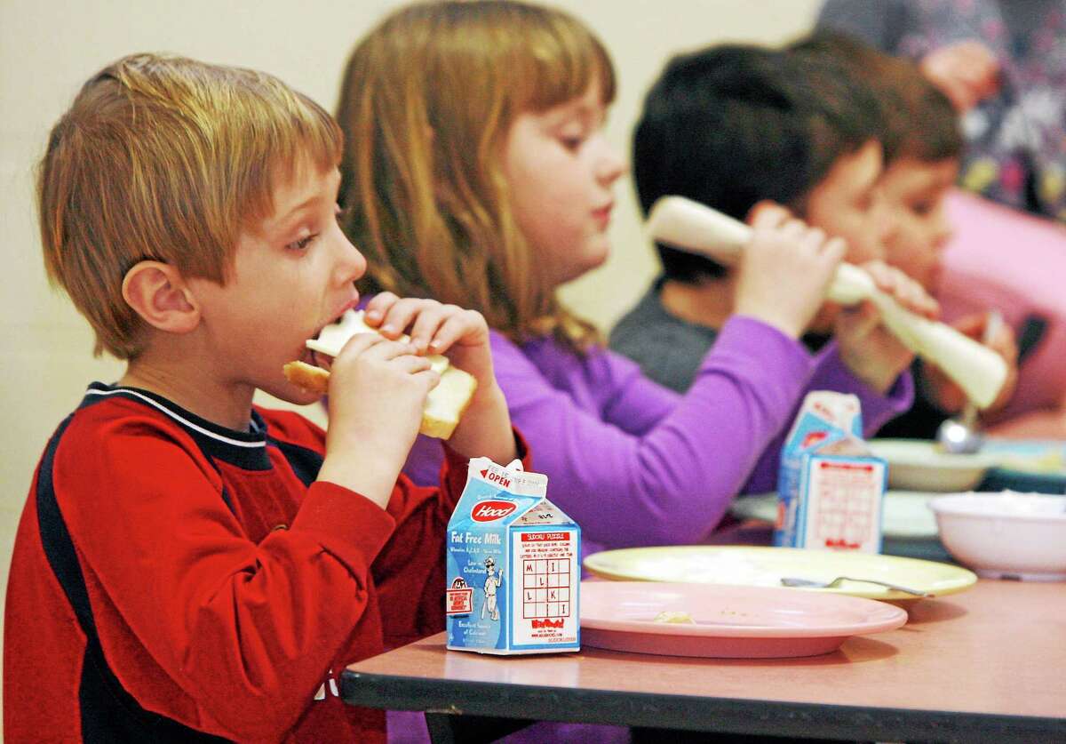 FILE- In this Feb. 3, 2010 file photo, students eat lunch at Sharon Elementary School in Sharon, Vt. Vermont ranks second in the country in an annual report of kids’ well-being. The Annie E. Casey Foundation’s Kids Count report released Monday shows improvements in eight areas like in the percentage of children with health insurance and fewer teen births but poverty continues to be a problem. Vermont fell slightly in the percentage of children with parents who lack secure employment to 29 percent. New Hampshire was the top-ranked state, followed by Vermont and Massachusetts. Nevada, Mississippi and New Mexico took the bottom three spots. Overall, Vermont ranked third in the country in education and family and community and fourth in health.